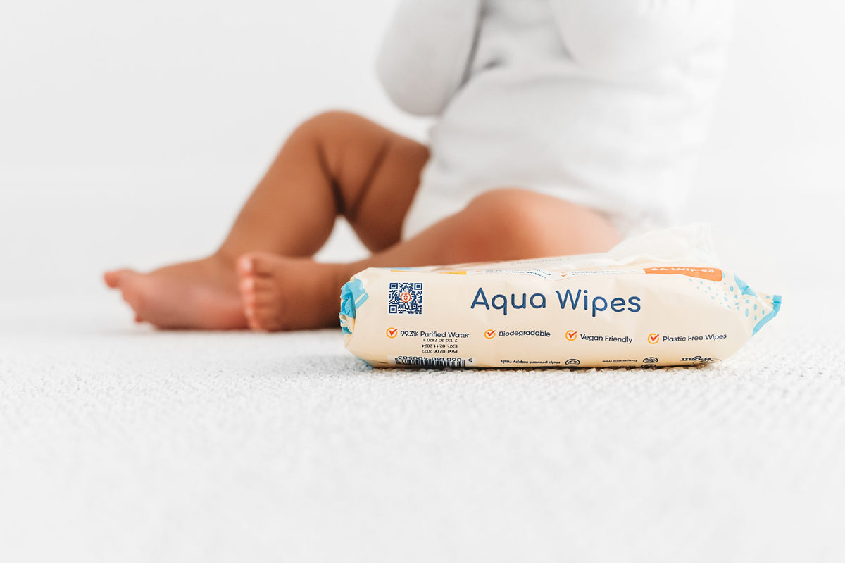 baby legs with pack of aqua wipes